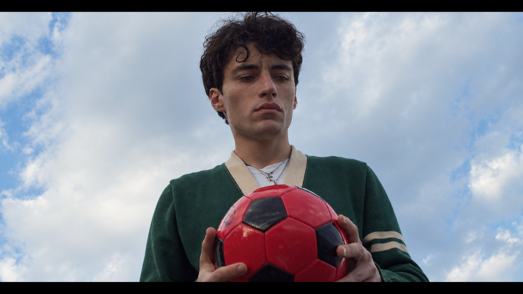 The Idealist holding a red football